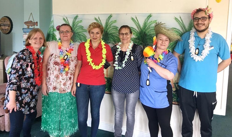 Staff dressed up for tropical fun day at Cornford House